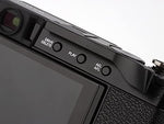 Haoge aluminum alloy hot shoe thumb up rest attached to a camera top plate.
