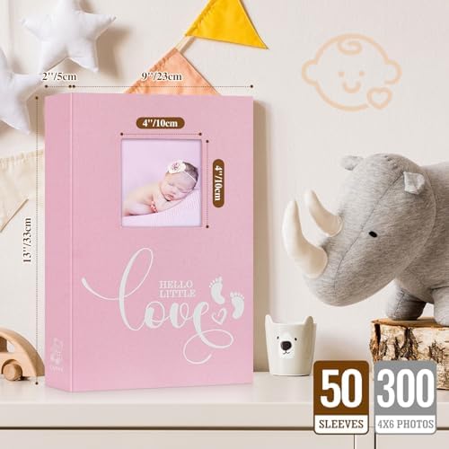 Lanpn pink newborn memory book open page layout displaying horizontal photo pockets and memo writing area.