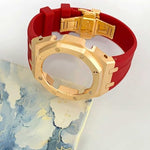 Stainless steel watch bezel with pink gold finish and durable silicone strap close up
