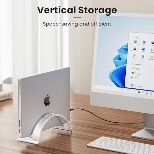 Yikola vertical notebook dock holding a silver MacBook on a modern workstation