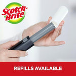 Compact Scotch-Brite travel size lint remover stored in a handbag