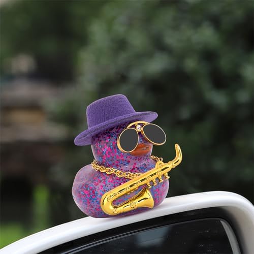 Wonuu duck car accessory with gold chain and miniature saxophone