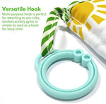 Amzoya toddler memory book attached to a stroller using the green plastic hanging hook