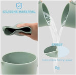 Mandoo food grade silicone washing cup being used for baby hair rinsing