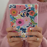 Kindle Paperwhite with floral cardstock insert installed
