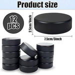 Twelve piece black foam hockey pucks for indoor sports practice