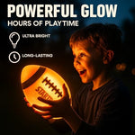 Rechargeable LED light up football being caught by a teenager outside