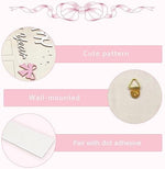 Close up of the monthly slots on the baby girl first birthday board
