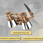 Premium black and white enamel theater glasses held by the elegant side handle grip
