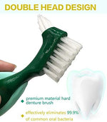 Pack of two green and light green manual denture care brushes for traveling