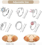 Six pieces of adjustable anti-stress rings displaying moon and star celestial designs.