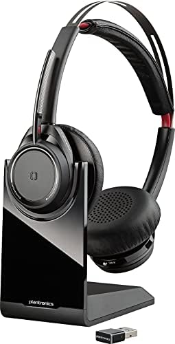 Poly Voyager Focus UC Teams version headset on desktop charging dock