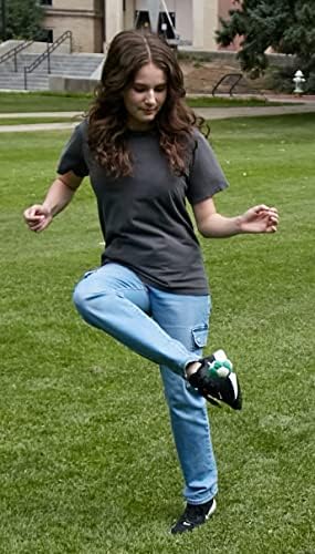 Interactive Bluetooth footbag being kicked in mid-air for coordination practice.