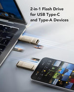 Lexar champagne silver metal thumb drive plugged into a modern slim laptop computer port