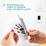 Four black ink pads and twelve white impression cards spread out neatly.