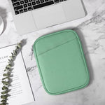 TiMOVO Bodhi Green tablet sleeve shown next to a compact electronic reader to illustrate precise sizing