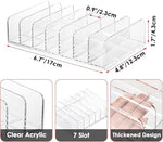 Two pack clear acrylic DVD storage box display on a modern desktop setup