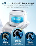 Tenker dental cleaning pod with open lid revealing the 220ML stainless steel tank.