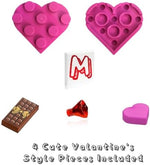 Close up view of the imported holiday brick set accessories including miniature pink hearts and a chocolate bar.