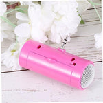 HOMSFOU small plug-in speaker demonstrating universal compatibility with a tablet and phone.