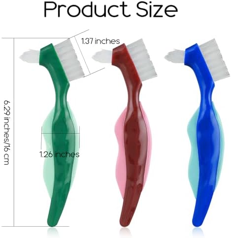Three pieces of multi colored false teeth toothbrushes with blue green and red handles