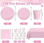 Close up of light pink scalloped disposable party plates and napkins.