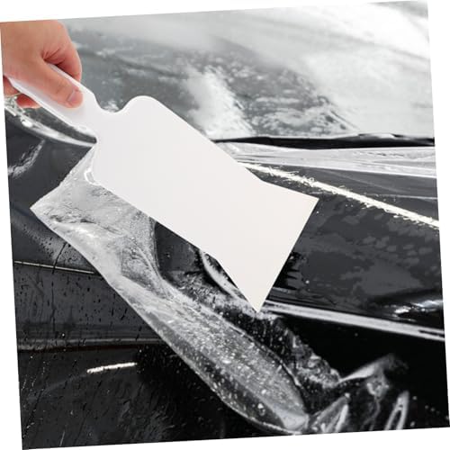 Close up view of the non scratch thermoplastic polyurethane edge removing trapped air bubbles from vinyl.