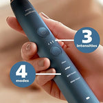 Philips Sonicare HX9911/92 electric toothbrush sitting inside the elegant bathroom glass charger base