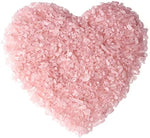 Close up of polished natural Rose Quartz crystal chips.