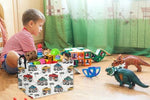 Essme monster truck nursery bin filled with toys and diapers on a bedroom shelf.