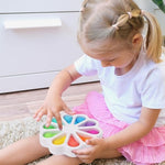 AFLUODN compact travel sensory toy packed inside a diaper bag for on-the-go toddler entertainment.