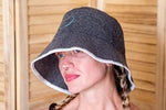 Halsa sauna hat worn by person in spa