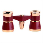 Compact 3x25 theater binoculars showcasing the vintage metal body and central focusing wheel