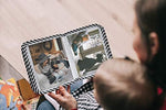 Premium nylon cloth first photo album for newborns packaged in a gift box.