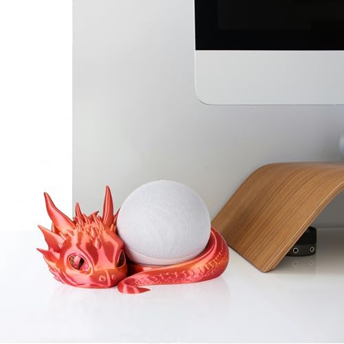 Dragon stand holding Echo Dot speaker on a bookshelf