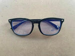 Clear protective lenses of the imported computer glasses blocking harmful blue rays from a laptop monitor.