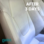 Geist ink remover being applied to a blue jean dye stain on a car seat.
