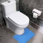 Close up view of the non slip backing particles on the Camargue floor protector mat showing secure placement on bathroom tiles.