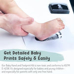 Safe baby ink pad being gently pressed onto a toddler foot for a memory scrapbook.