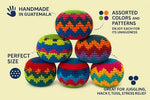Close up view of the hand-crocheted cotton stitching on the geometric pattern kick bags.