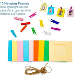 Self standing plastic desk frames in vibrant colors holding instant film prints.
