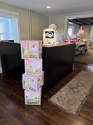 Winnie the Pooh baby milestone frame arranged alongside plush toys as nursery decoration setup.