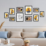 Giftgarden ten pack multi size black frames arranged symmetrically around an I love you to the moon and back sign.