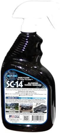 Near neutral pH multi surface cleaner for removing automotive grease soot and household grime safely.