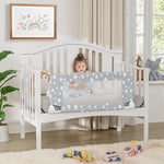 NUTIKAS toddler bed safety rail installed on a standard nursery crib preventing toddler falls.