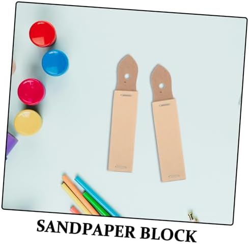 Close up of artist sharpening a pastel stick on sandpaper block