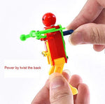 Miniature battery free dancing robot toys in vibrant random shades of blue red and green