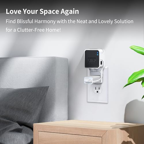 Side angle of Kidjoyo smart home camera module bracket plugged into a clean wall outlet.