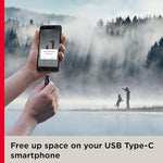 SanDisk high performance OTG storage drive compact design on a dark surface
