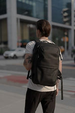 AirVault Ventures expandable compression backpack showing the integrated HyperSeal vacuum valve and portable electric pump.